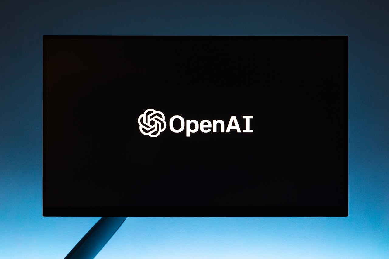 why-choose-us Minimalist display of OpenAI logo on a screen, set against a gradient blue background.