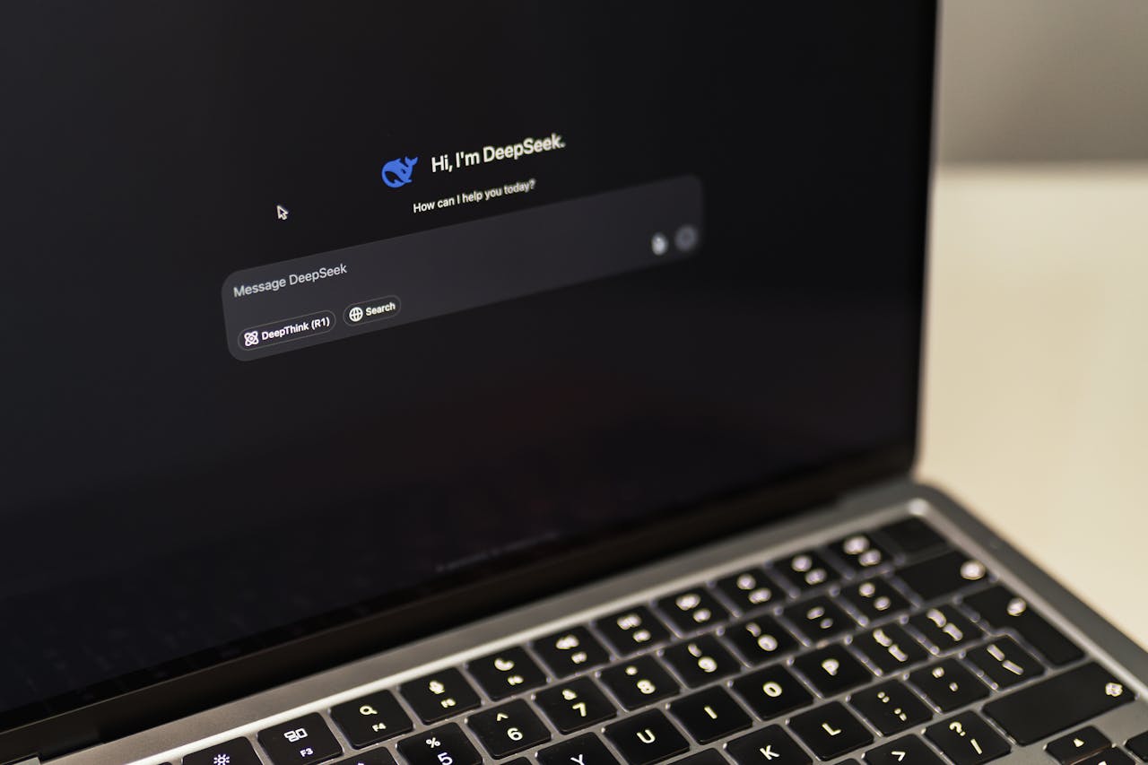 services-03 A MacBook displaying the DeepSeek AI interface, showcasing digital innovation.