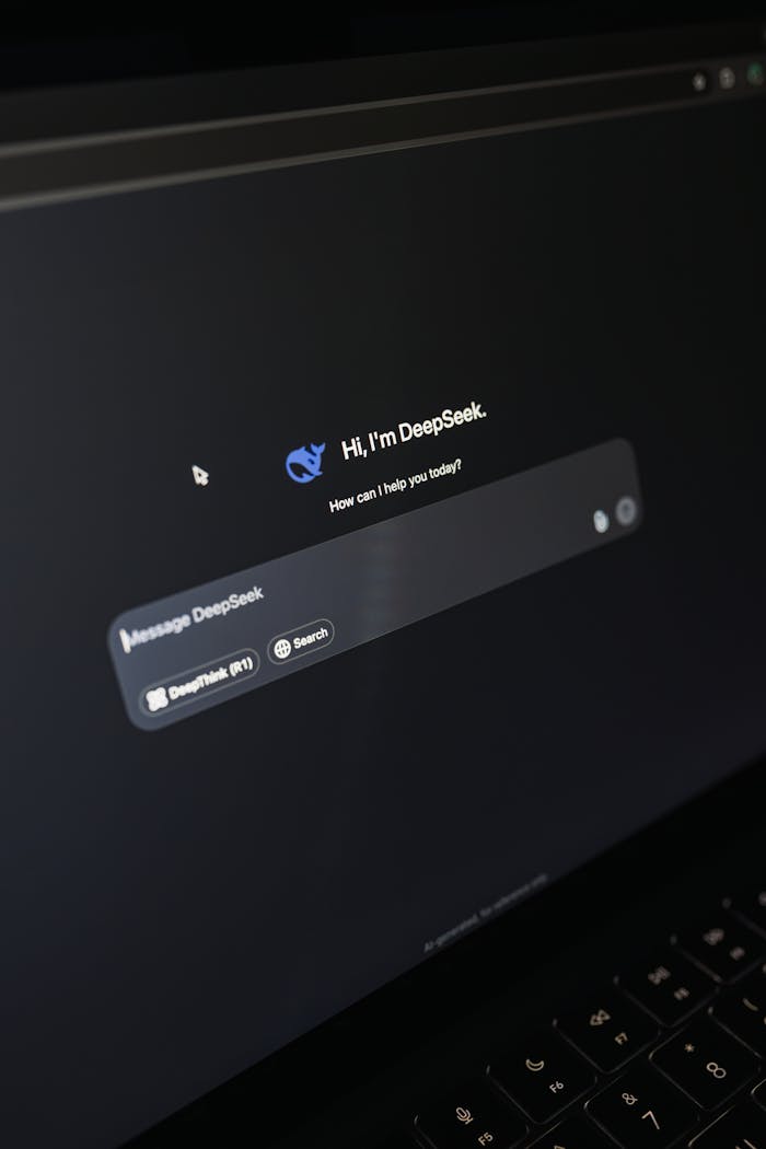 who-we-are Close-up of a laptop screen displaying an AI chatbot interface with a dark theme.